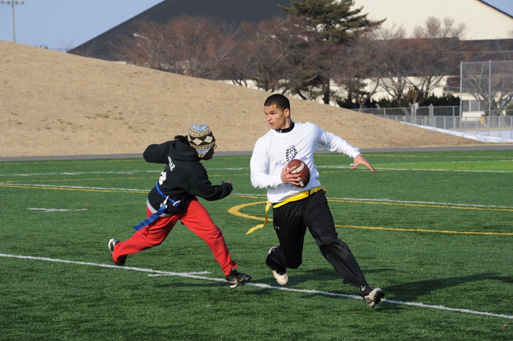 Sailors and Airmen compete in the Third Annual Misawa Air Base Snow Bowl Flag Football Tournament