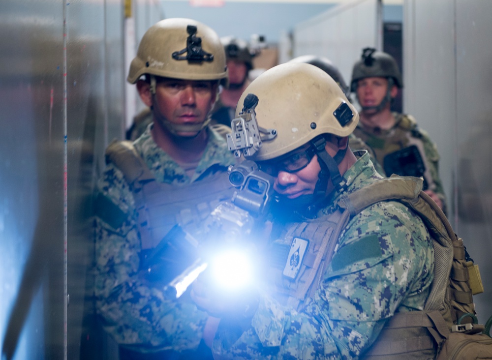 US military combat cameramen practice VBSS tactics