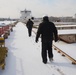 Coast Guard marine inspectors walk through moored vessels in Toledo
