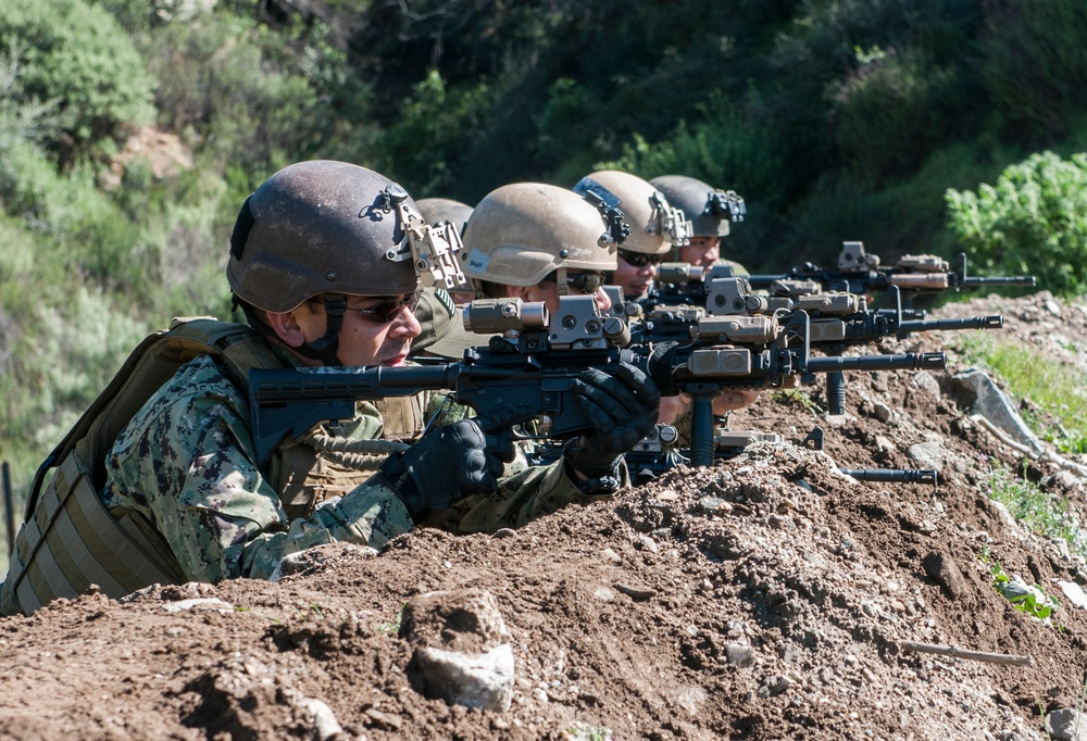 US military combat camera service members train in combat tactics