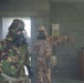 British forces practice CBRN procedures in a US Army facility