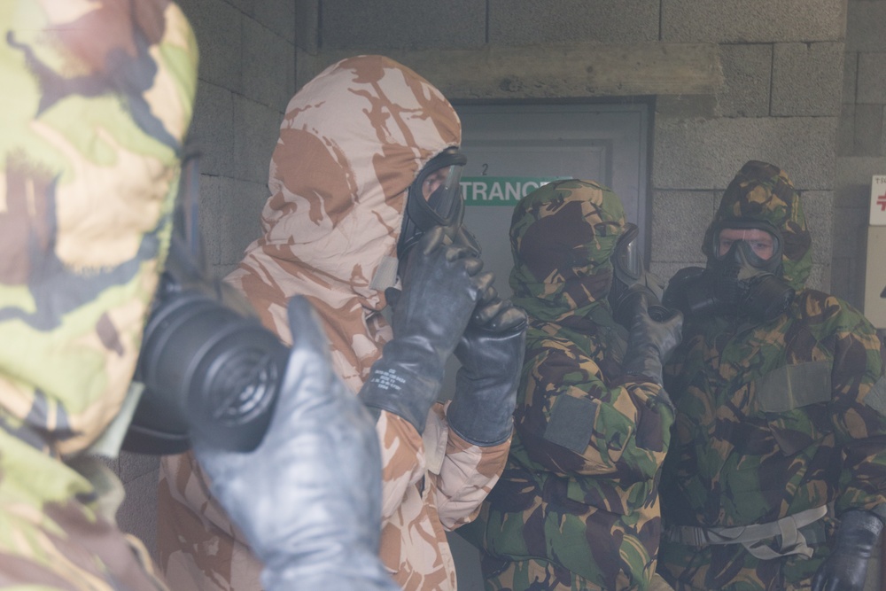 British forces practice CBRN procedures in a US Army Facility