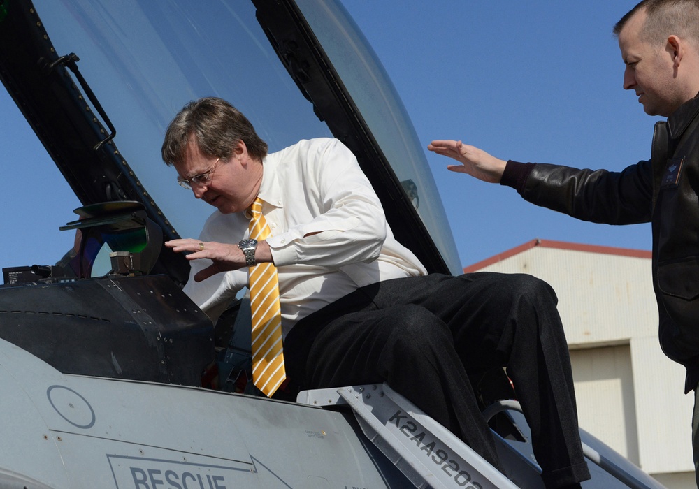Maj. Chris Wells explains proper and safe entry into an F-16 Fighting Falcon cockpit to Tulsa Mayor Dewey F. Bartlett Jr.