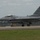 2015 Australian International Airshow and Aerospace & Defence Exposition A U.S. Air Force F-16 Fighting Falcon jet is taxiing or rolling on a runway. The aircraft bears tail code 'WW' and serial number 'AF 92-912', indicating it belongs to the 35th Fighter Wing based at Misawa Air Base, Japan. The aircraft is in standard gray camouflage with a red-tipped tail fin.