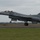 2015 Australian International Airshow and Aerospace & Defence Exposition An F-16 Fighting Falcon jet fighter is captured in the moment of takeoff from a runway. The aircraft bears tail code 'WW' and serial number 'AF 82-912', indicating it belongs to the 35th Fighter Wing based at Misawa Air Base, Japan. The image shows motion blur on the runway surface, emphasizing the aircraft's speed during departure.
