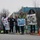 Volunteers with signs