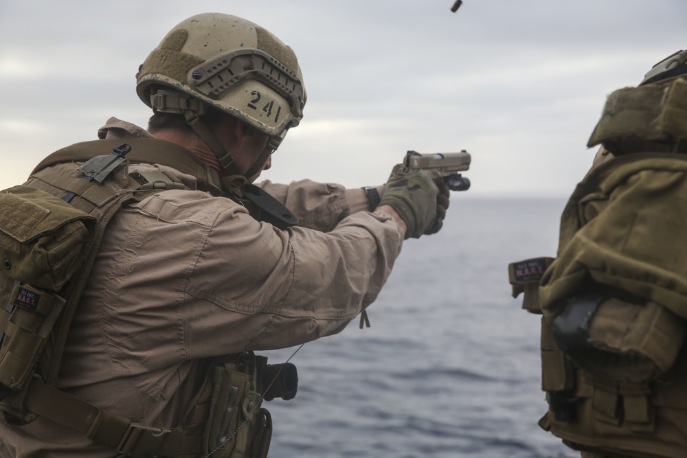 15th MEU Marines fire weapons during flight-deck quals