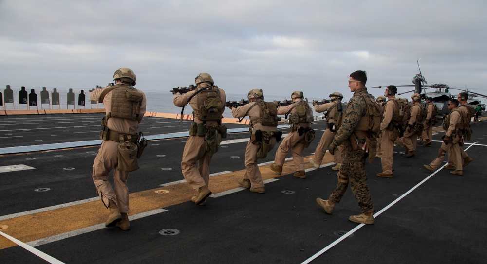15th MEU Marines fire weapons during flight-deck quals
