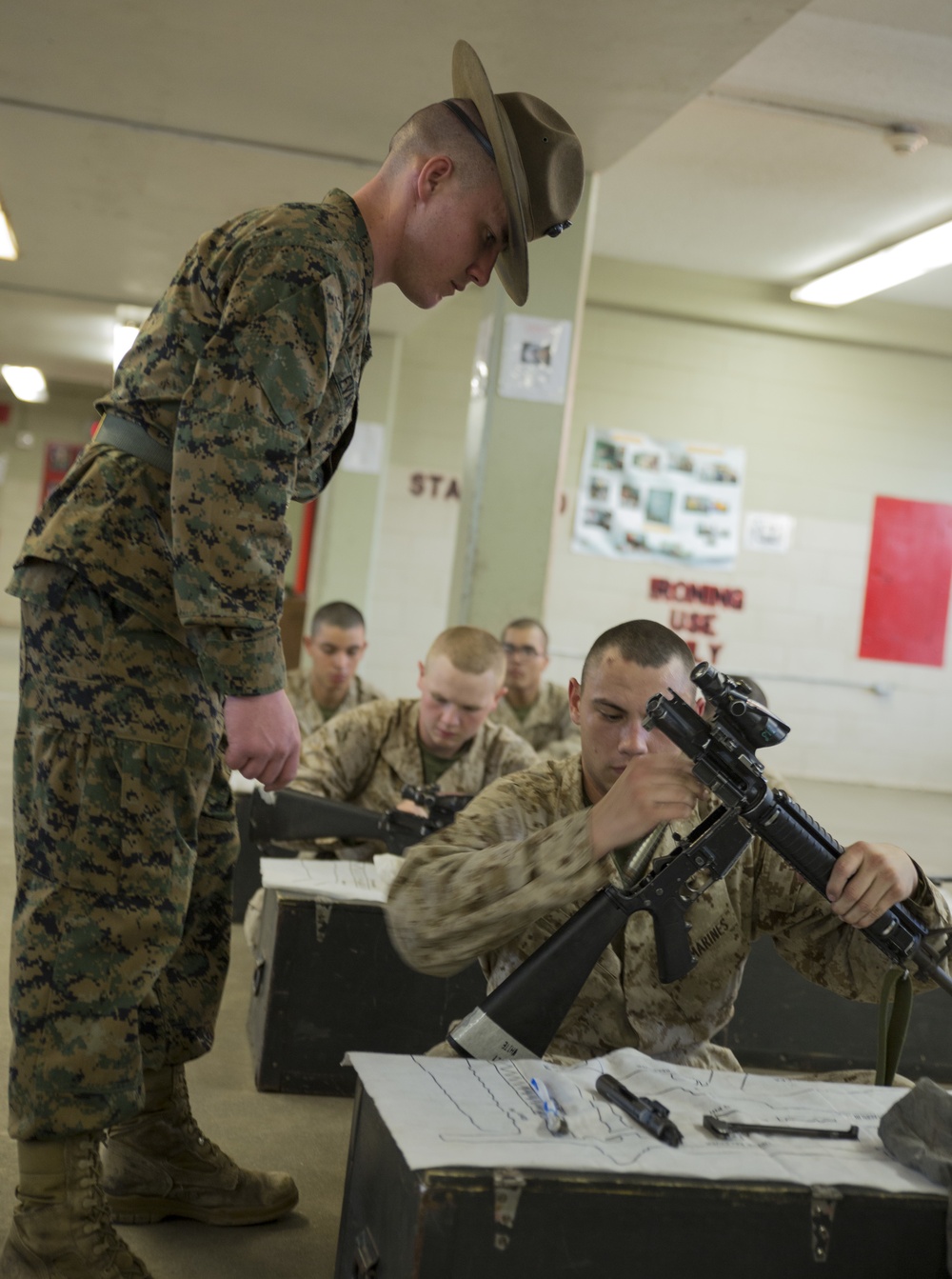 Marine recruits learn rifle maintenance on Parris Island
