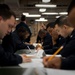 USS America Sailors take petty officer first class advancement exam