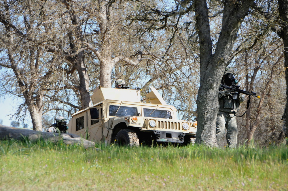 Soldiers of the 571st Military Police Company conduct perimeter defense during simulated chemical weapons attack