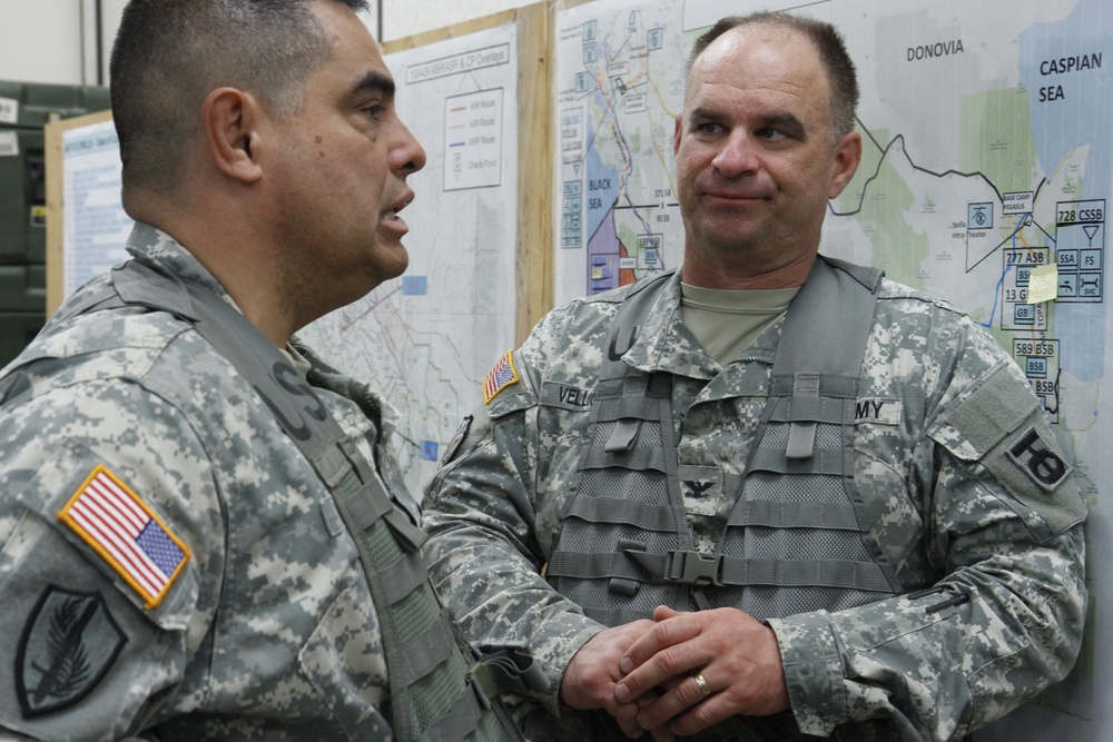 Brig. Gen. John D. Lee of the 91st Training Division and Col. John Velliquette from the 90th Sustainment Brigade discuss training scenarios