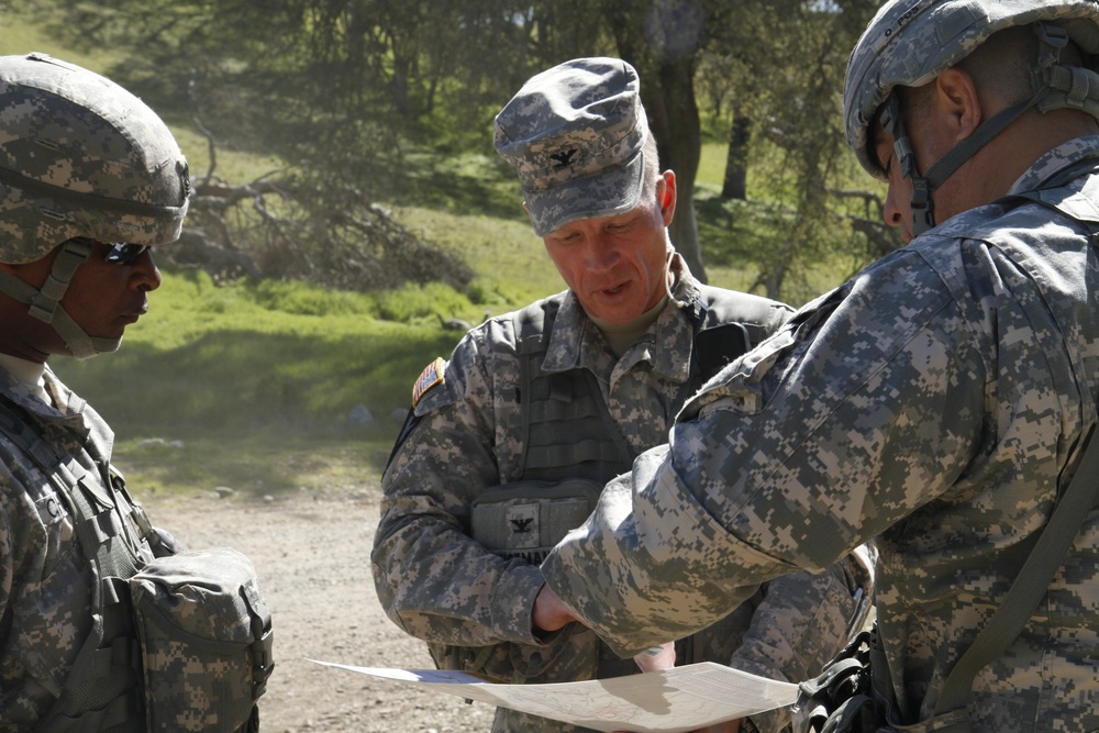 Brig. Gen. John D. Lee and Command Sgt. Maj. Gregory S. Chatman of the 91st Training Division are shown some of the events and scenarios soldiers will be tested on during the Combat Support Training Exercise (CSTX)