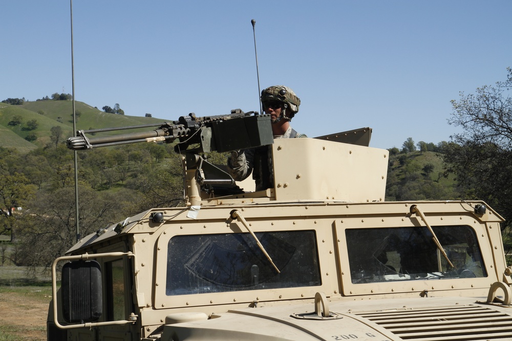Pfc. Nicholas Arm of the 377th Military Police Company pulls security in a convoy during the 91st Training Division's Combat Support Trainging Exercise (CSTX)