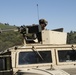 Pfc. Nicholas Arm of the 377th Military Police Company pulls security in a convoy during the 91st Training Division's Combat Support Trainging Exercise (CSTX)