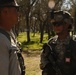 US Army Spc. Saul Aguilear of the 804th Medical Brigade stands guard during