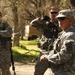 US Army Master Sgt. Matt Gould of the 91st Training Division conducts an after-action review with soldiers from the 209th Quartermaster Company