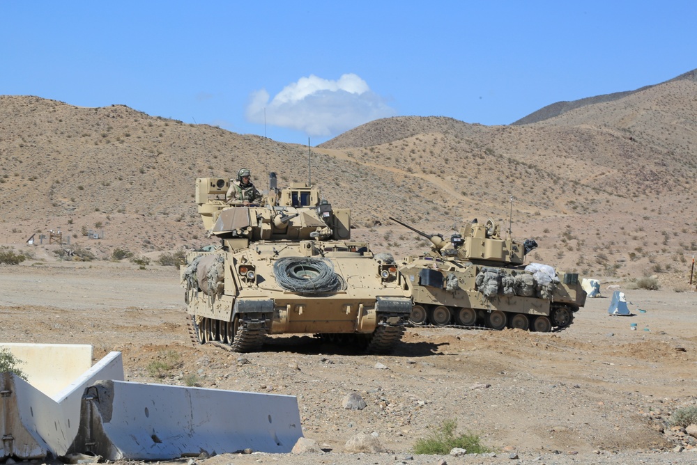 Soldiers from the 1st Calvary Regiment provide security during an exercise at the National Training Center 