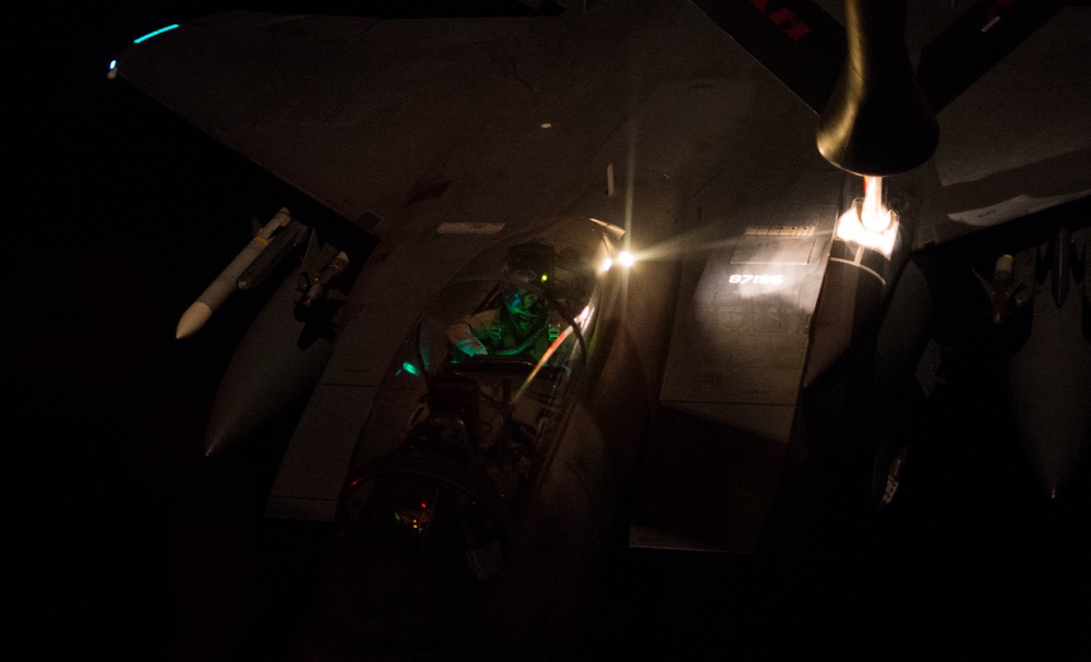 USAF KC-135 refuels USAF F-15Es at night for OIR
