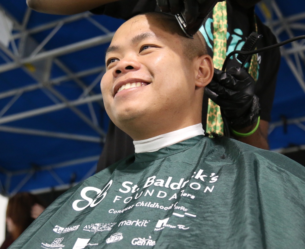 Soldier shaves head in support of cancer research