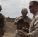 2D Transportation Support Battalion Marines practice throwing hand grenades with Headquarters Battery