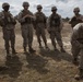 2D Transportation Support Battalion Marines practice throwing hand grenades with Headquarters Battery