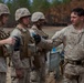 2D Transportation Support Battalion Marines practice throwing hand grenades with Headquarters Battery