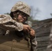 2D Transportation Support Battalion Marines practice throwing hand grenades with Headquarters Battery