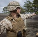 2D Transportation Support Battalion Marines practice throwing hand grenades with Headquarters Battery