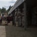 2D Transportation Support Battalion Marines practice throwing hand grenades with Headquarters Battery
