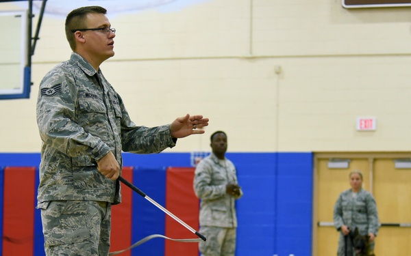 799th SFS K-9 handlers demonstrate military working dog skills, training to students