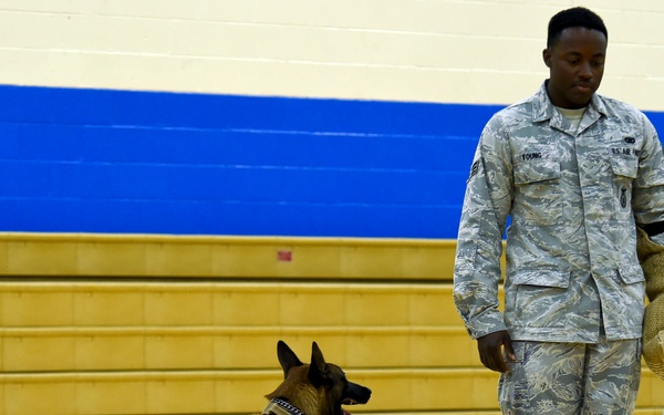 799th SFS K-9 handlers demonstrate military working dog skills, training to students
