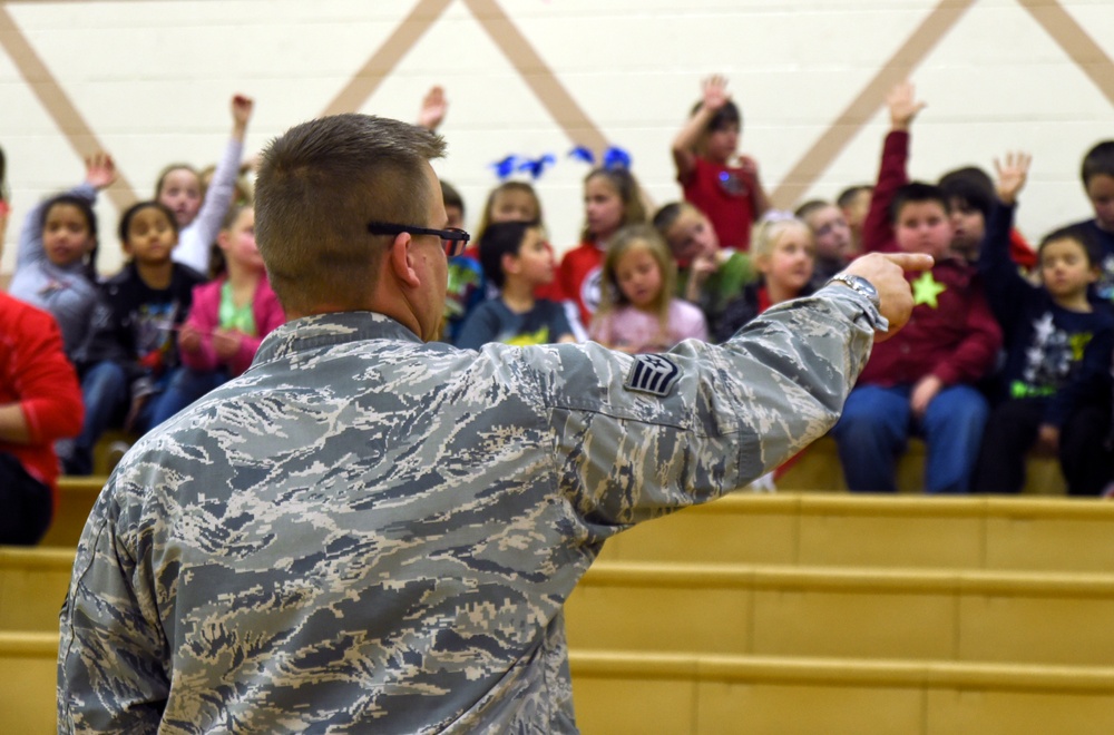 799th SFS K-9 handlers demonstrate military working dog skills, training to students