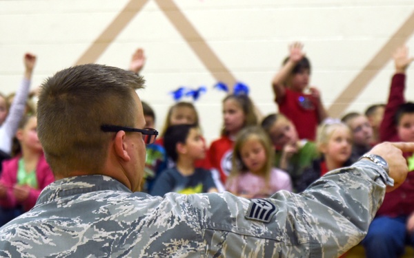 799th SFS K-9 handlers demonstrate military working dog skills, training to students