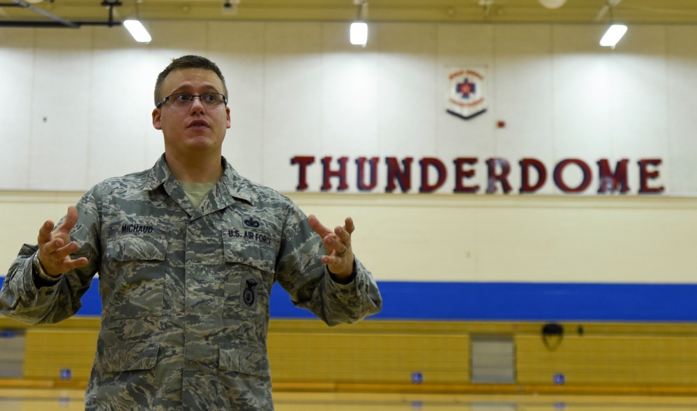 799th SFS K-9 handlers demonstrate military working dog skills, training to students