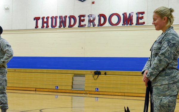 799th SFS K-9 handlers demonstrate military working dog skills, training to students