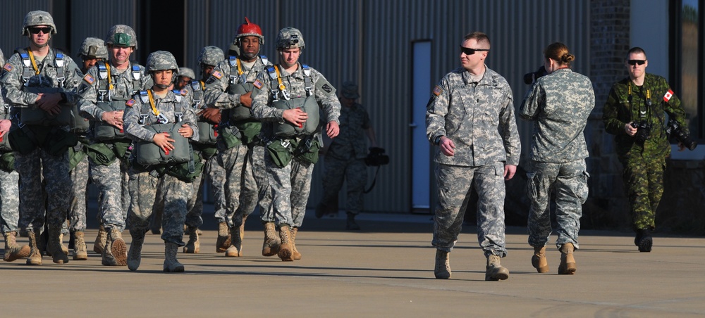 Combat Camera Servicemen and Women Prepare for Airborne Jump