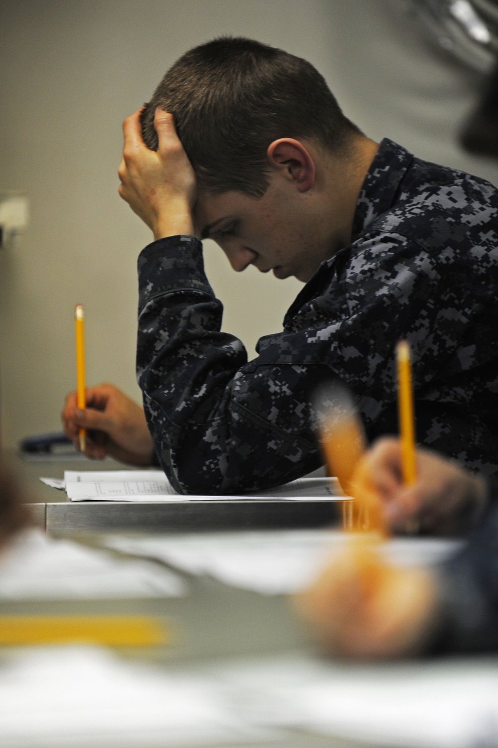 USS San Diego Sailors take advancement exam