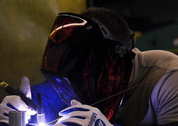 Aircraft metal technology shop crafts precision art to repair jets