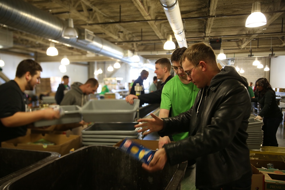 Marines sort and pack food at the Greater Boston Food Bank