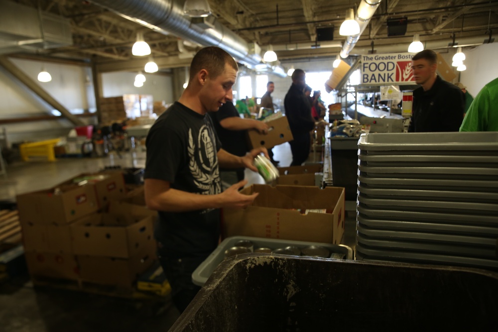 Marines sort and package food at the Greater Boston Food Bank