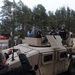Latvian girl sits in US Army military vehicle