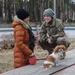 Soldier talks with Latvian girl in Saulkrasti, Latvia