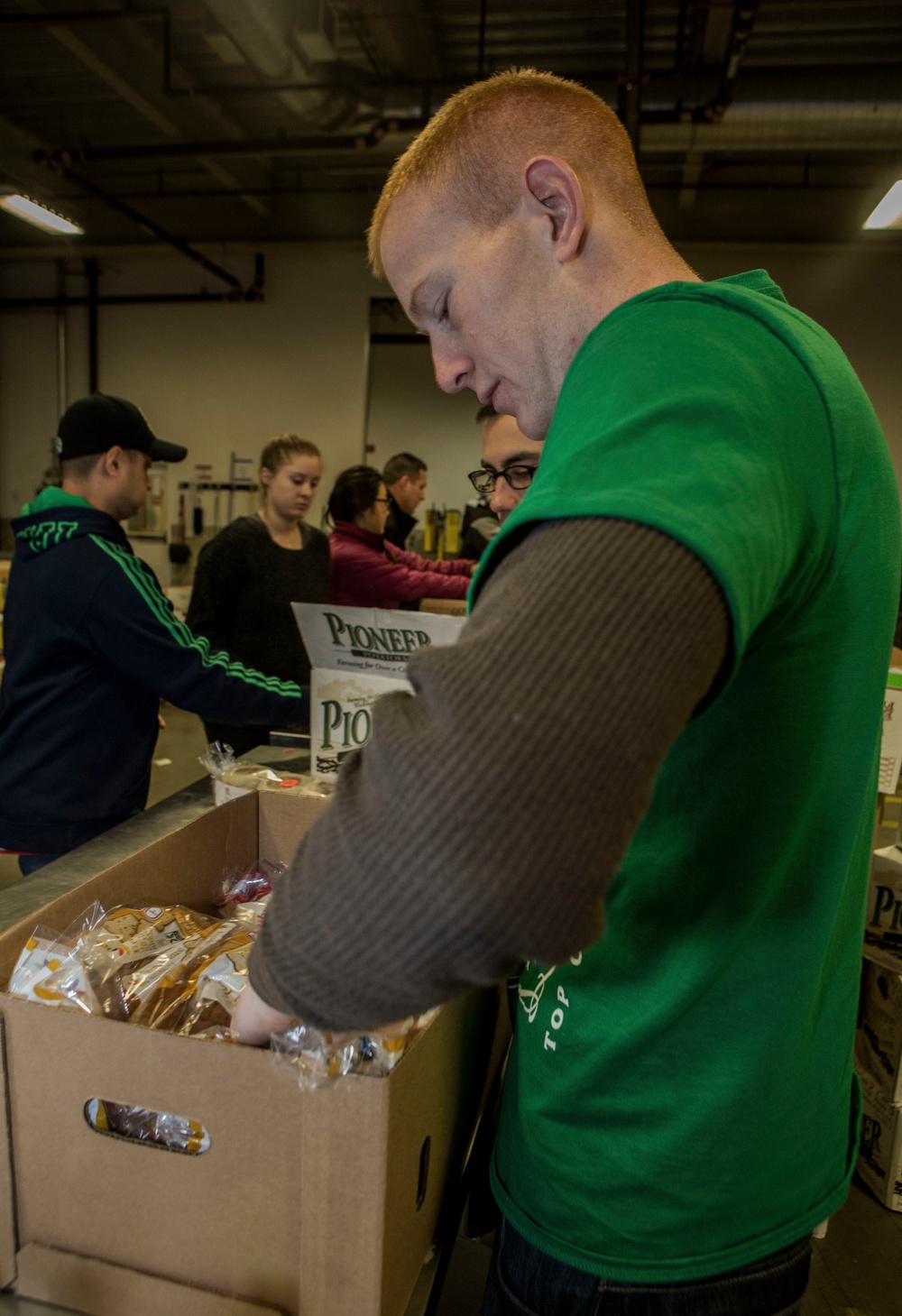 U.S. Marines package food for charity at the Greater Boston Food Bank