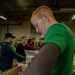 U.S. Marines package food for charity at the Greater Boston Food Bank