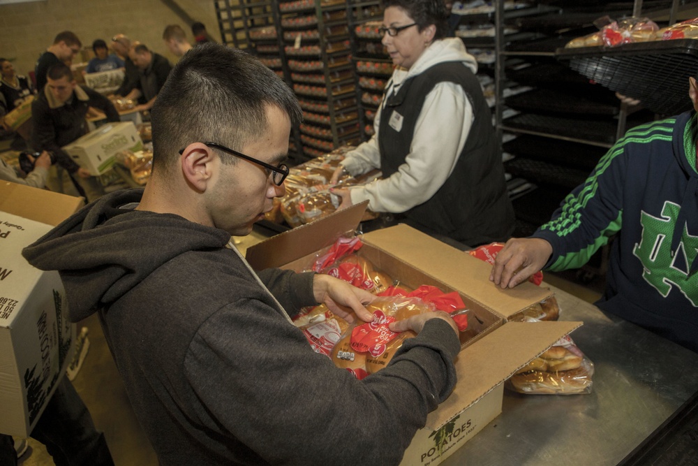 U.S. Marines package food for charity at the Greater Boston Food Bank