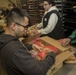 U.S. Marines package food for charity at the Greater Boston Food Bank