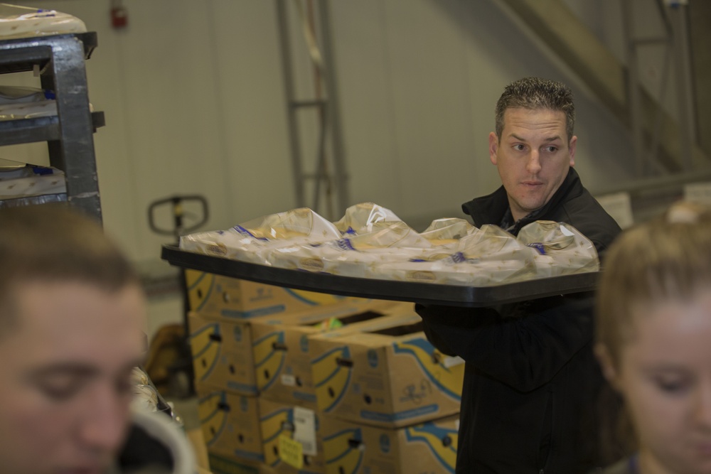 U.S. Marines package food for charity at the Greater Boston Food Bank