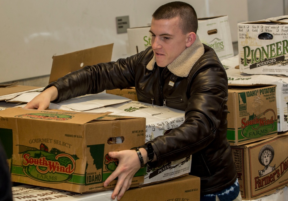 U.S. Marines package food for charity at the Greater Boston Food Bank