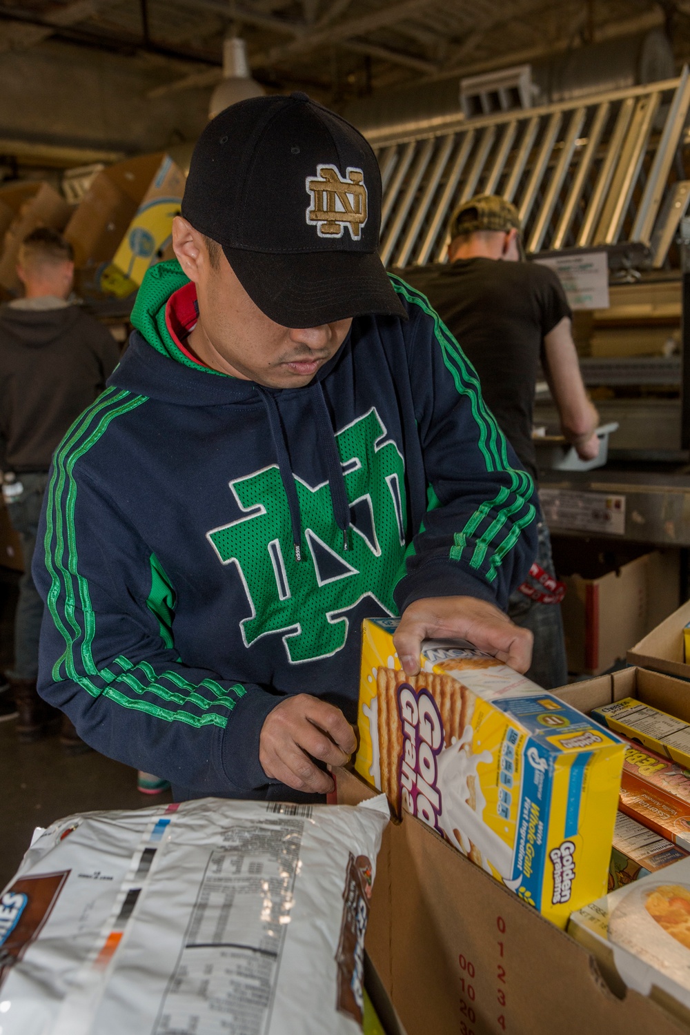 U.S. Marines package food for charity at the Greater Boston Food Bank